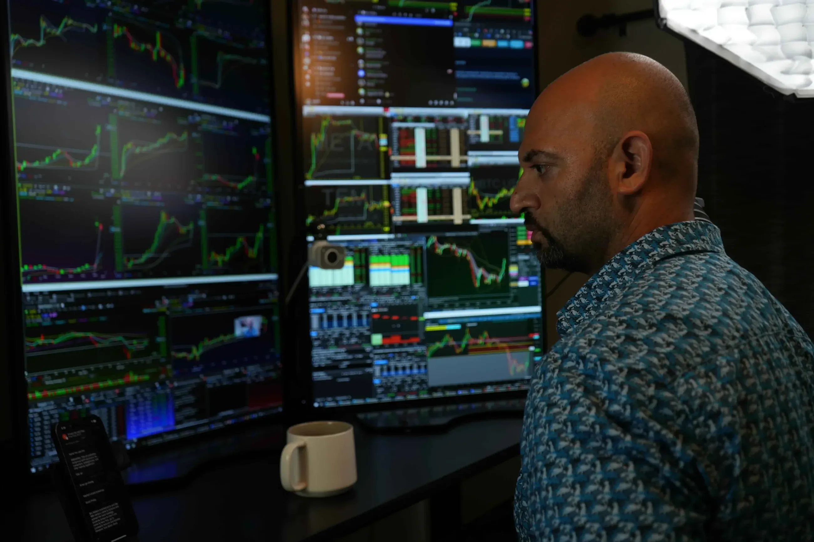 Kunal Desai at his trading desk, monitors filled with charts and the BOWS chatroom